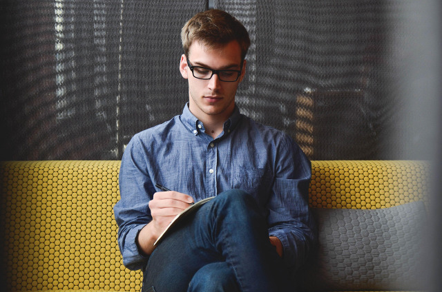 subtle collaboration, two people in focused conversation at desk